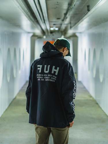 clothing man standing in hallway coat