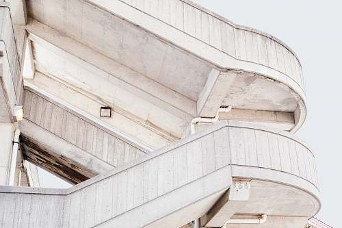stairwell beige concrete stairs with white skies background stairway