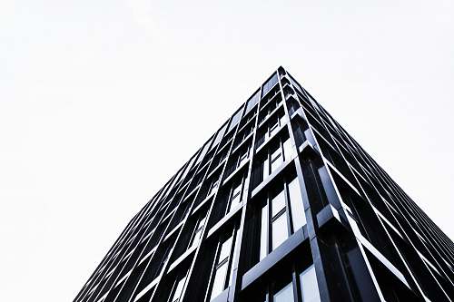 building black concrete building during daytime urban