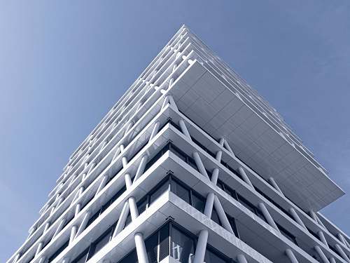 building low-angle photo of white high-rise building skyscraper
