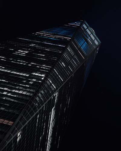 building low-angle photography of high-rise building at nighttime skyscraper