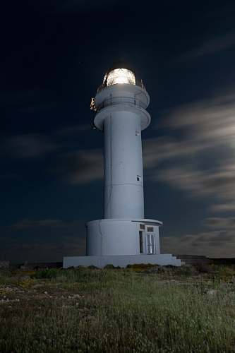 building white tower house turned on lighthouse