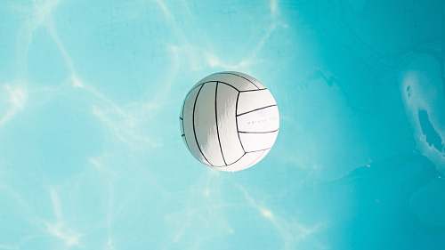 blue closeup photo of white ball on body of wager levitation