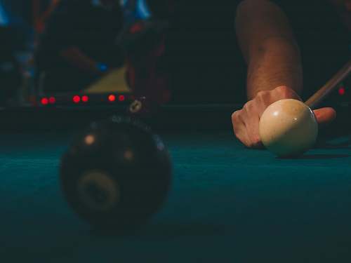 sphere person playing billiards brown