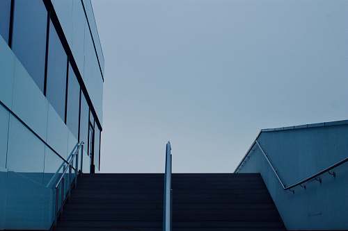 handrail low-angle photography white glass building railing
