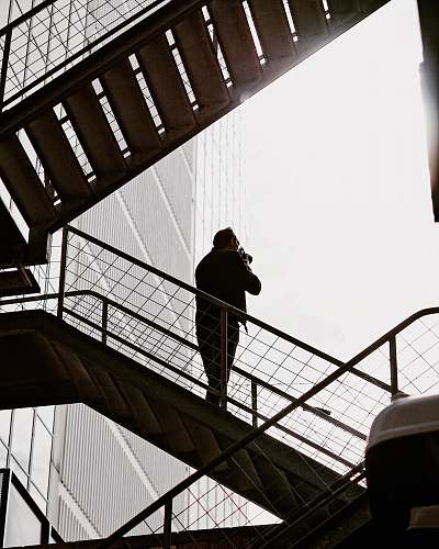 handrail man on stairs railing