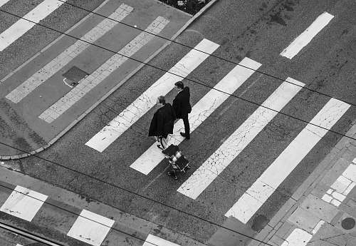 france aerial photography of men walking on pedestrian lane road
