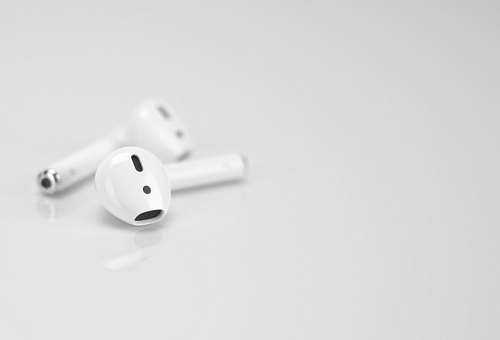 grey Apple AirPods on white surface game