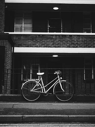bike bicycle parked near metal railings bicycle