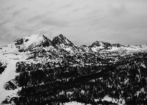 mountain black and white mountain covered with snow outdoors