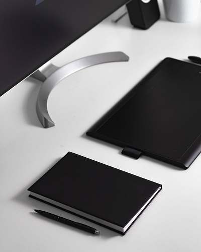 pc black click pen beside book and tablet computer cell phone