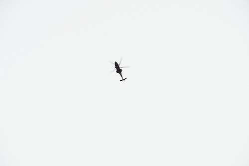 sky black helicopter on sky during daytime flying