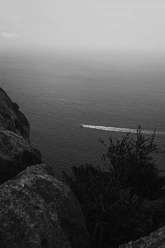 grey boat in water nature
