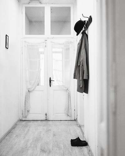 coat coat hanged on wall hooks clothing