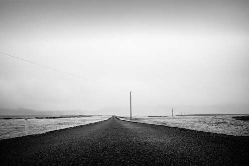 asphalt dirt road during day tarmac
