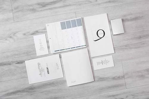 white flat-lay photography of white printer papers paper