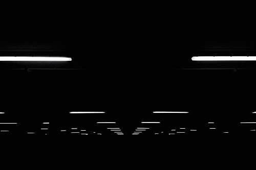 night fluorescent light lot on black ceiling tournai