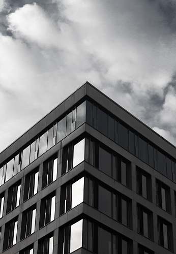 architecture gray building under cloudy sky during daytime building