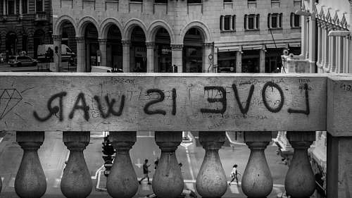 railing gray concrete wall with love is war text trieste