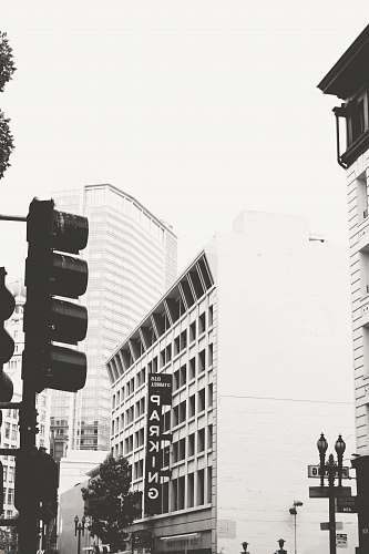 light gray high-rise building traffic light