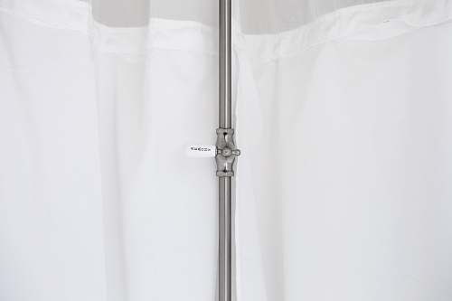 grey gray metal pole beside white curtain indoors