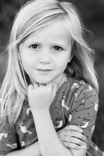 human graysale photography of girl wearing long-sleeved top person