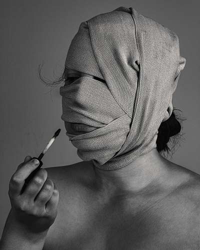 grey grayscal photo of woman with bandage on face skin