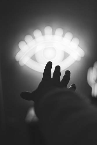 worship grayscale of hand finger