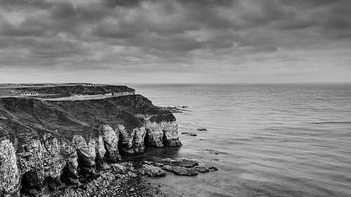ocean grayscale og land near sea sea