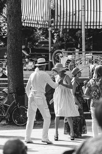 human grayscale photo of a man and woman in white person