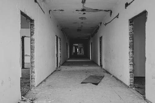 corridor grayscale photo of building interior floor