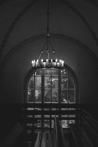 architecture grayscale photo of ceiling lamp building