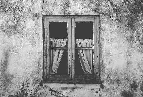 grey grayscale photo of closed window wall