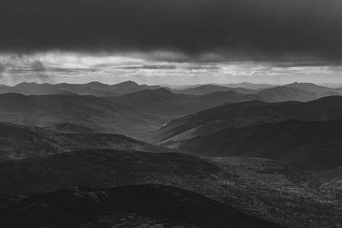 grey grayscale photo of hill and cloud horizon mountain