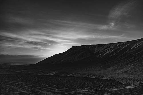 nature grayscale photo of mountain outdoors
