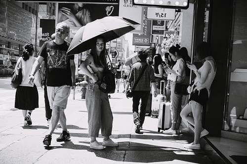 apparel grayscale photo of people in street shoe