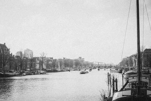 outdoors grayscale photo of sailing ship water
