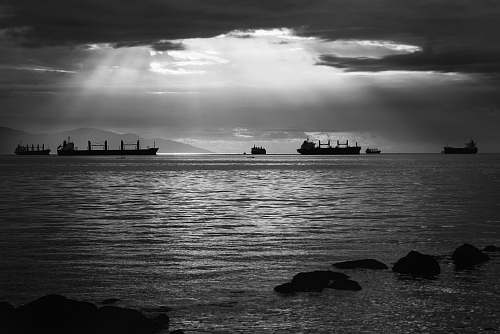 grey grayscale photo of ships on water boats