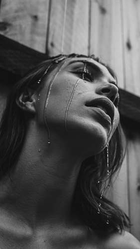 female grayscale photo of wet woman woman
