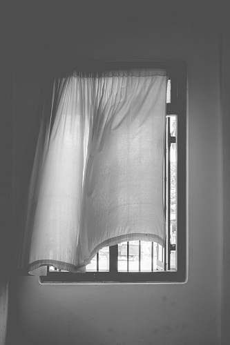 grey grayscale photo of window curtain home decor