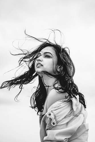 human grayscale photo of woman face