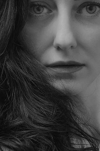 human grayscale photograph of woman face