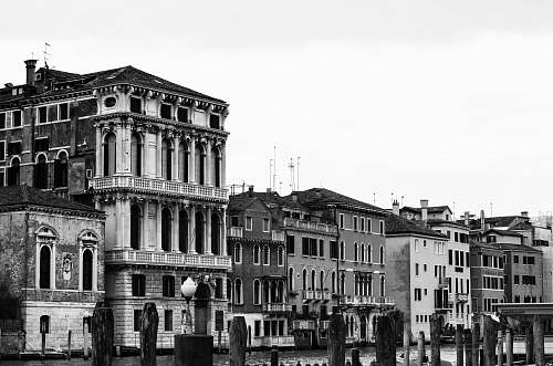 water grayscale photography of building venice
