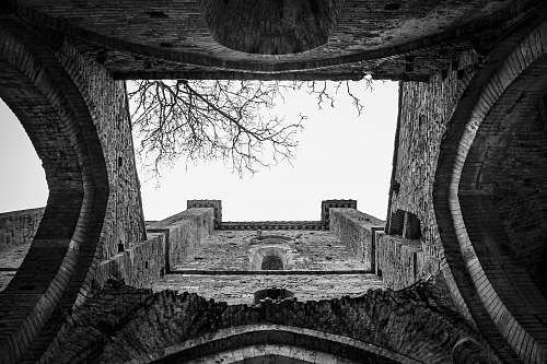 building grayscale photography of concrete building hole