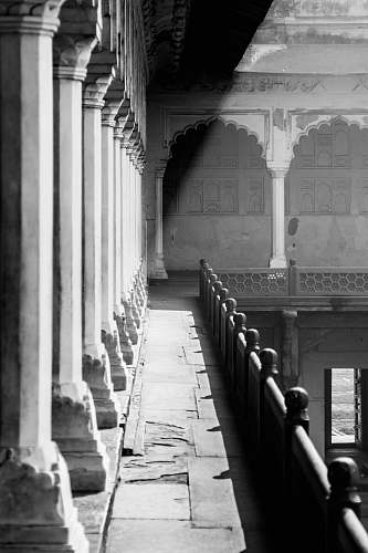 banister grayscale photography of corridor handrail