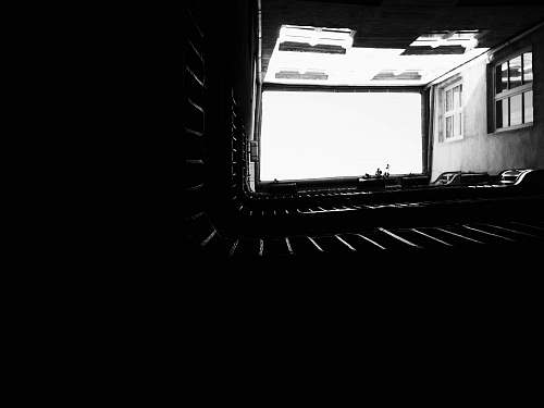 indoors grayscale photography of garage interior design