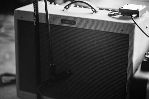 black grayscale photography of guitar amplifier amp