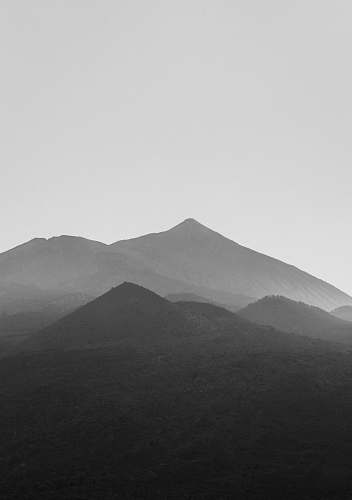 mountain grayscale photography of mountains mountain range