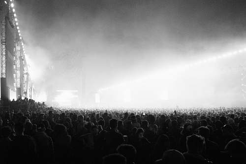 indoors grayscale photography of people in concert interior design