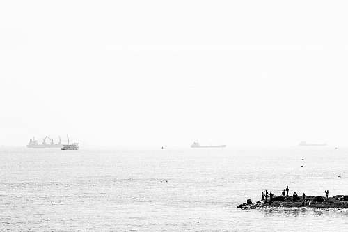 white grayscale photography of sea vehicle